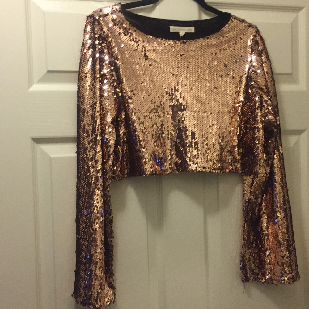 Stylish rose gold sequins blouse... never worn.